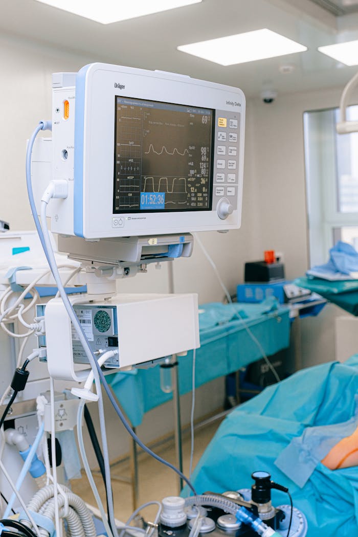 digital-01 Close-up of vital signs monitor in a modern operating room setup.